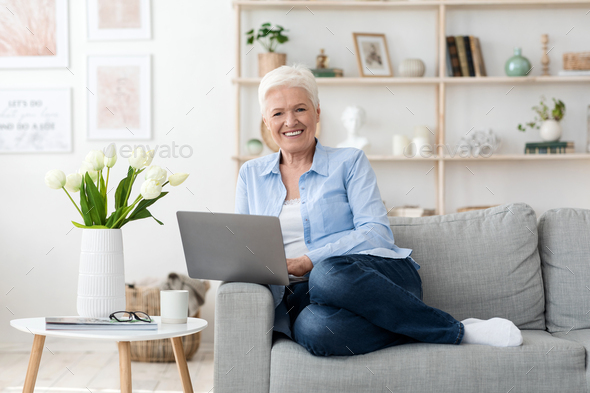 Freelance Jobs For Seniors. Happy Elderly Lady Using Laptop Computer At Home