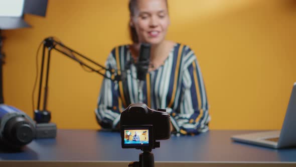Selective Focus on Camera While Social Media Star Records an New Podcast Episode alt