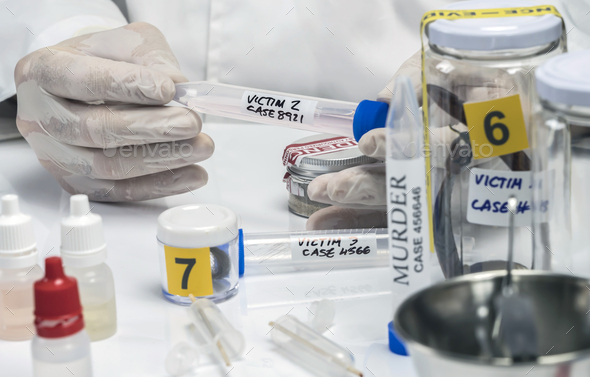 Specialized criminalistic police performs hematological analysis with forensic test kit in a murder in a crime lab, conceptual image