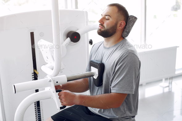 Bearded man having rehabilitation after injury in physiotherapy clinic