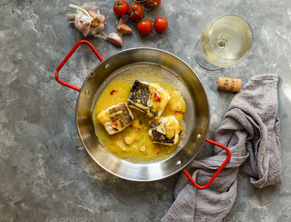 bacalao al pil pil, salted cod in emulsified olive oil sauce, spanish ...