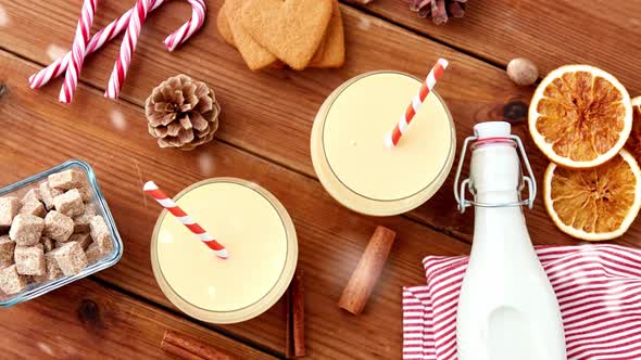 Glasses of Eggnog, Ingredients and Spices on Wood alt