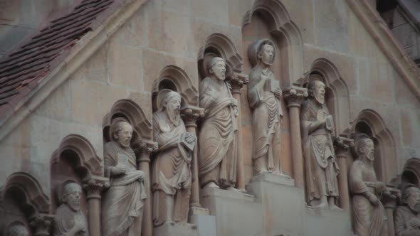 Stone statues in the facade of church