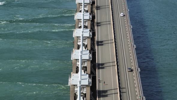 Sea Water Passing Through a Storm Barrier Bridge alt