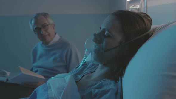 Father assisting her sick daughter at the hospital