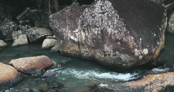 Closeup Thailand's Waterfall River Rocky Shore with Rapids Stones at Than Sadet National Park alt