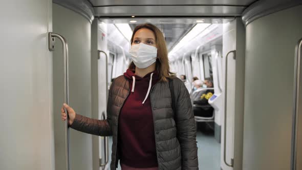 Vaccinated Masked Woman in Train Subway on Commute to Work alt