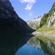 flying over a blue mountain lake in the swiss alps. Mountains reflect in the clear water. alpstein s - VideoHive Item for Sale