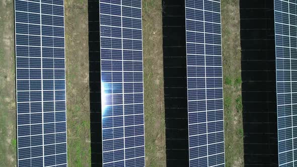 Aerial Top Down View of Solar Power Station Field at Sunny Day. Aerial Top View of Solar Farm