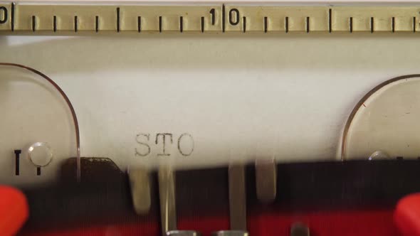 Red Typescript STOP COVID on Stationary Mechanical Typewriter