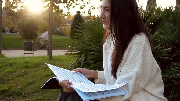 Slow Motion Studying Happy Young Woman Reading Her Book for School. Beautiful Mixed Race Asian