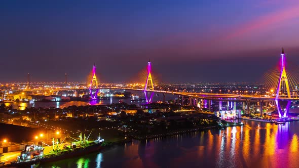 day to night time lapse of Bhumibol suspension bridge cross over Chao Phraya River in Bangkok