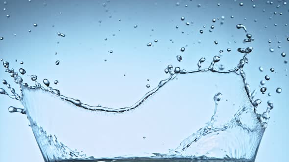Super Slow Motion Shot of Water Splash at 1000Fps on Blue Gradient Background alt
