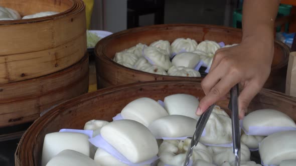 Steaming Bao Dim Sum Bread Bun In Bamboo Basket