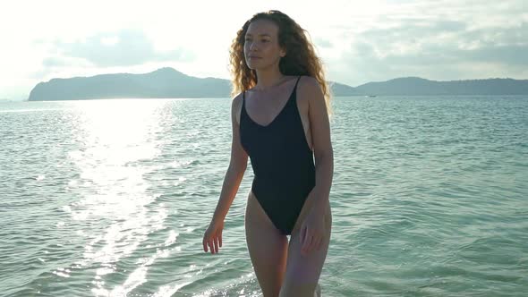 Woman on Balck Swimwear Walking in Slowmo Koh Tean Beach alt
