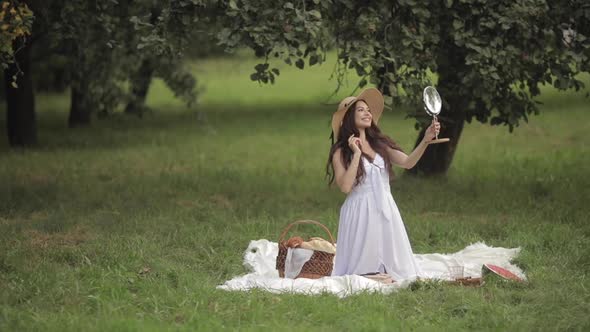 A Beauty Looking in the Mirror in Park.