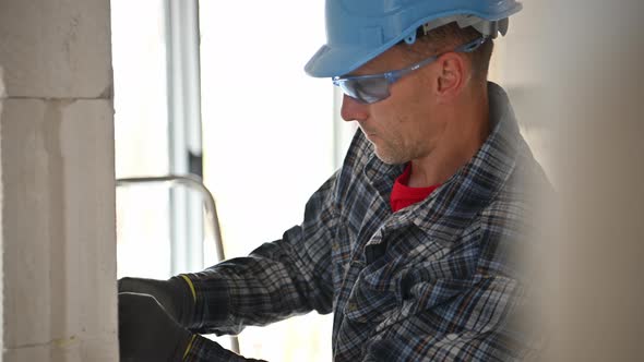 Electrician Worker Building Electric Systems Inside Residential Building alt