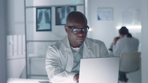 Pulmonologist Using Laptop alt