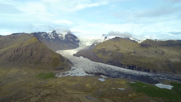 North Landscape And Huge Ice Glacier Between Mountains