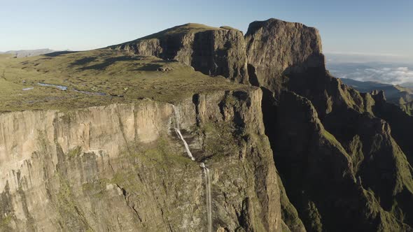 Aerial View of people camp at the Torceira Pico waterfalls on the mountain. alt