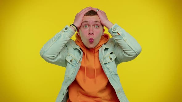 Cheerful Teen Man Raising Hands in Surprise Shocked By Sudden Victory Meeting Someone Wow Emotion alt