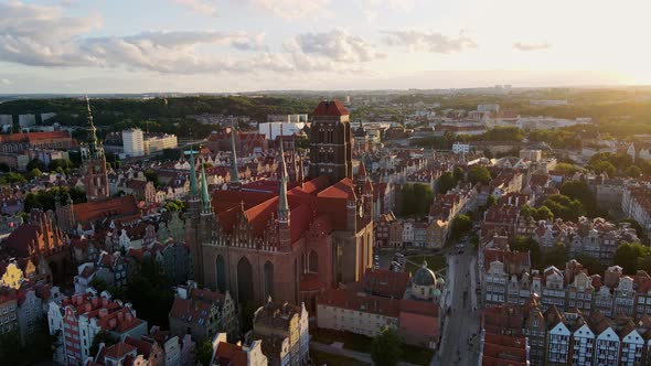 Camera Flying Over a Gothic Medieval Castle with High Spires and a Clock