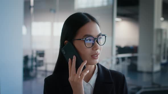 Asian Businesswoman Talking On Phone Communicating At Work In Office alt