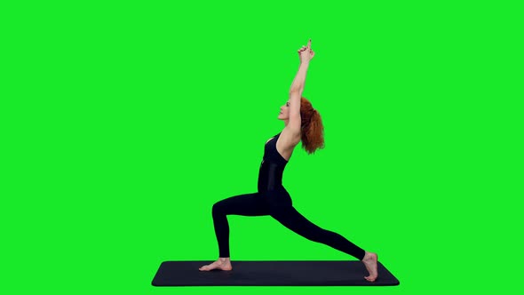 Sporty Slim Woman In Black Bodysuit Doing Yoga Exercises On Green Screen