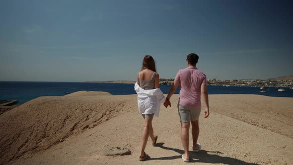 Travelling in Summer Vacation Young Man and Woman are Visiting Natural Landmarks alt