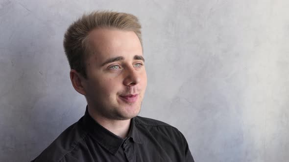 A Dreamy European Man is Sitting at the Window and Drinking Hot Tea the Sun is Shining Enjoying a alt