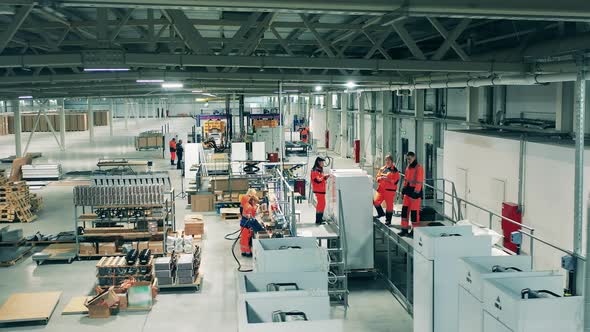 Refrigeration Factory Unit with Fridges and Employees alt