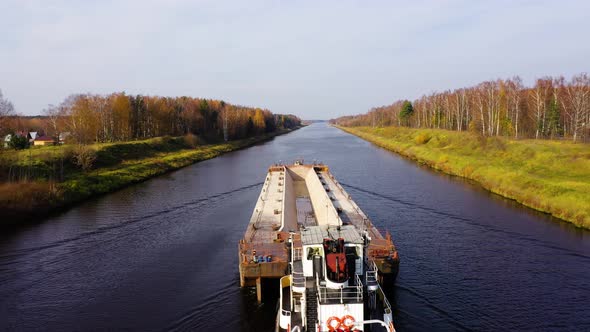 Aerial view:Barge on the River. Autumn Landscape, River Canal Near the Forest alt