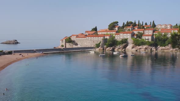 Beautiful Blue Sea Near Island of Sveti Stefan on Sunny Summer Day in Montenegro alt