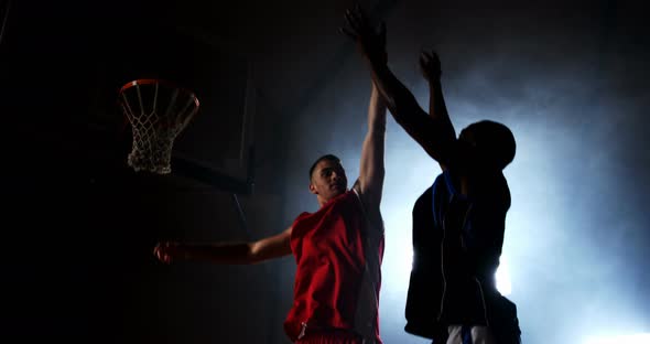 Sportsmen playing basketball alt