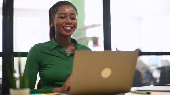 Video Chat with Smiling Africanamerican Business Woman alt