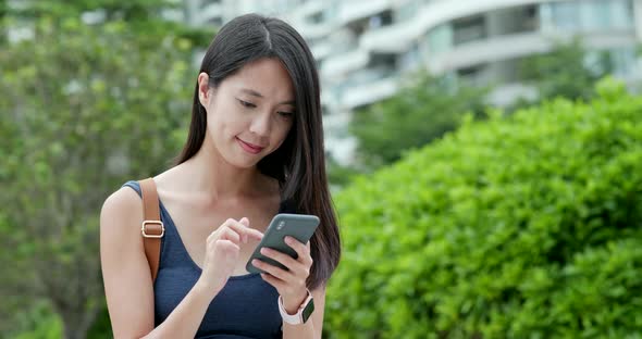 Woman working on mobile phone  alt