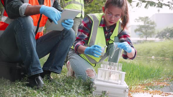 Biological engineer team collected samples of wastewater from industrial in a test tube
