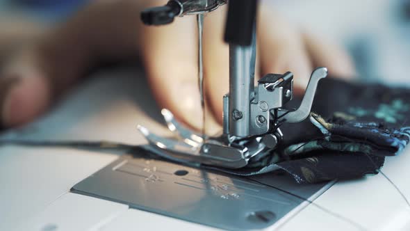 Female Hands Work on Sewing Machine