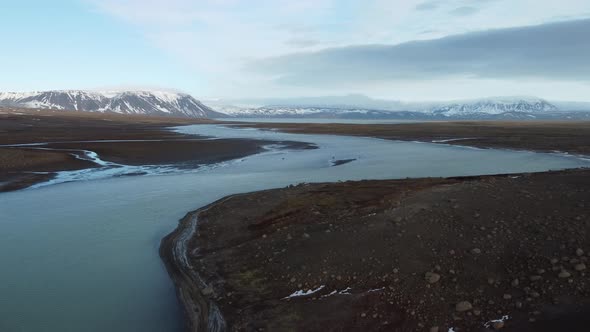 Flying Up From the River with Glaciers in the Background alt