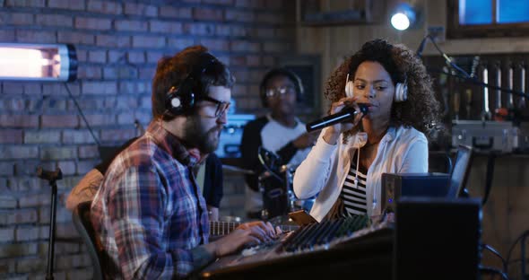 Young Musicians Playing in Home Studio alt