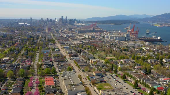 Wide aerial drone view flying over beautiful Vancouver, British Columbia, Canada. alt
