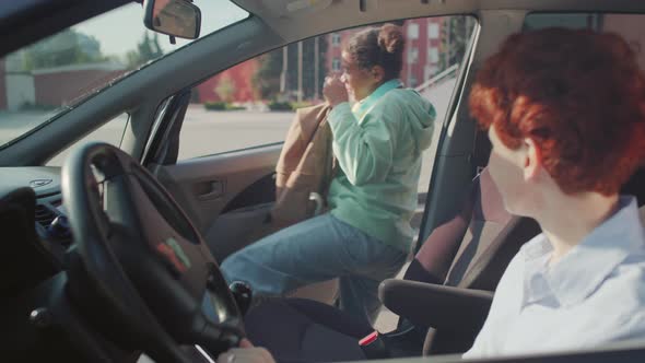 Mother Dropping Kid Off at School alt