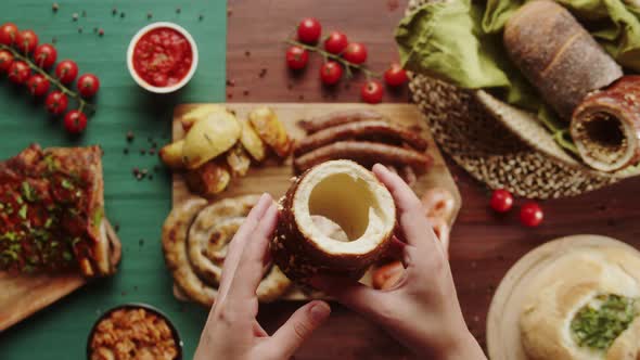 Eating Fresh Baked Trdelnik with Sugar and Nuts Closeup alt