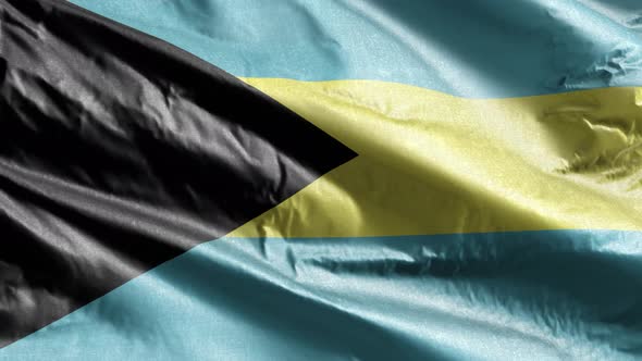Bahamas textile flag waving on the wind. Slow motion. 20 seconds loop.  alt