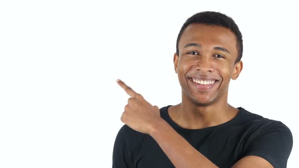 Pointing on Side, Afro-American Handsome Man, White Background alt