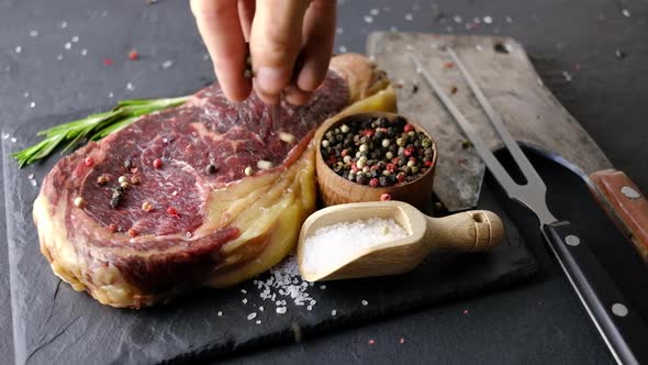 Marbling Ribeye Steak on Black Plate