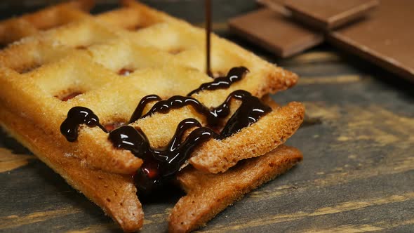 Topping Delicious Belgian Waffles with Chocolate Topping