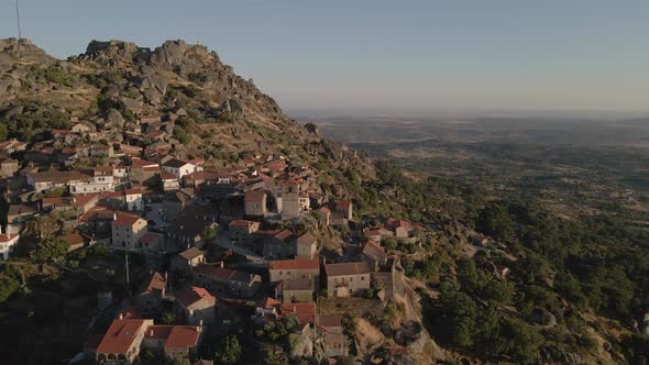 Drone flying over Monsanto village, Portugal. Aerial forward alt