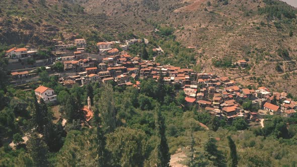 Rise Aerial of Highland Town Village on Mountain Hill Area in Troodos Mount Olympus alt
