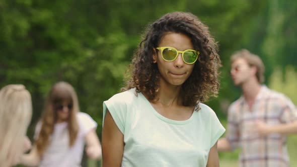 Beautiful Biracial Girl With Snow-White Teeth Smiling and Posing for Camera alt